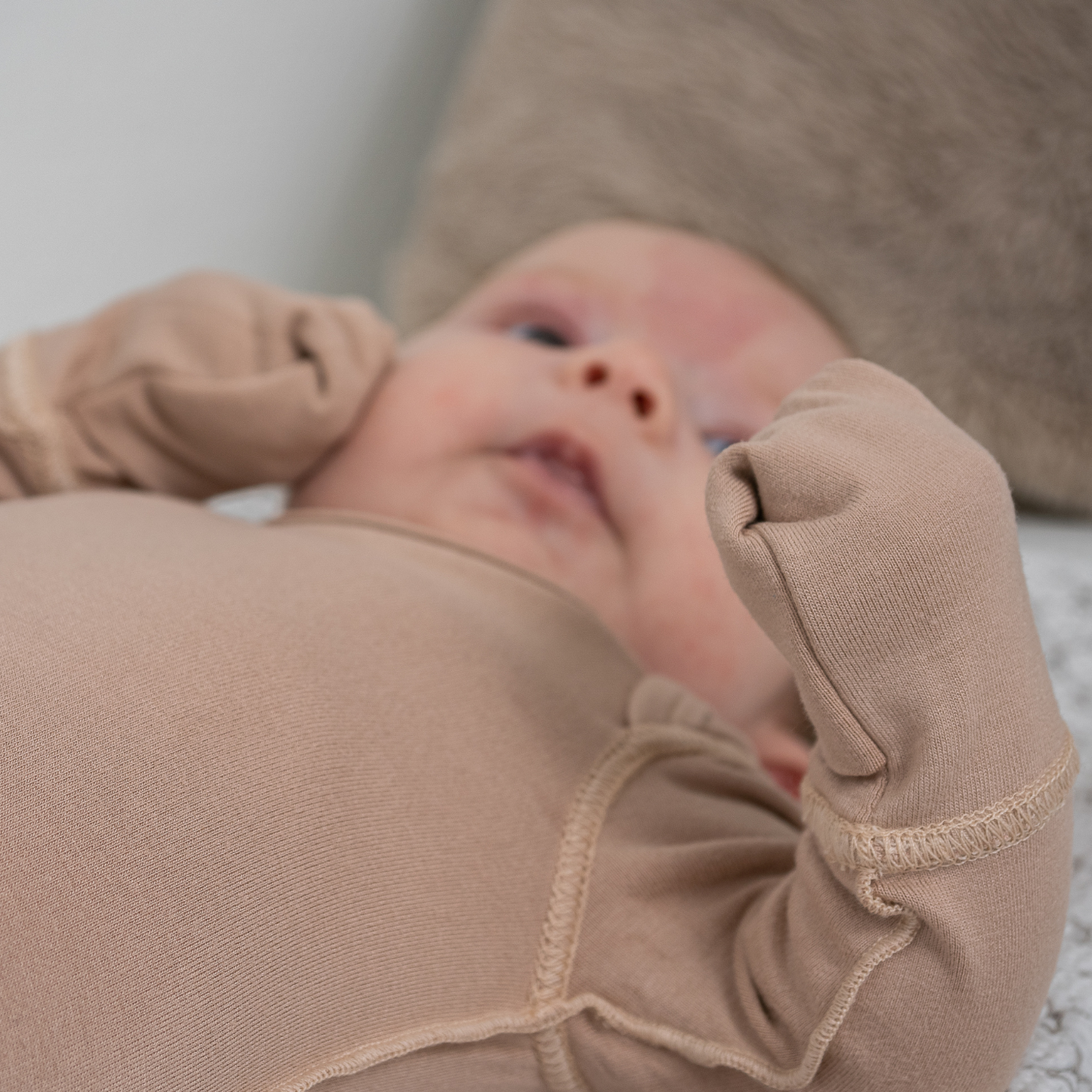 Baby With Eczema On Face Wearing Mahogany Rose Baby Bodysuit With Anti-scratch Mittens From SOOTHLA.