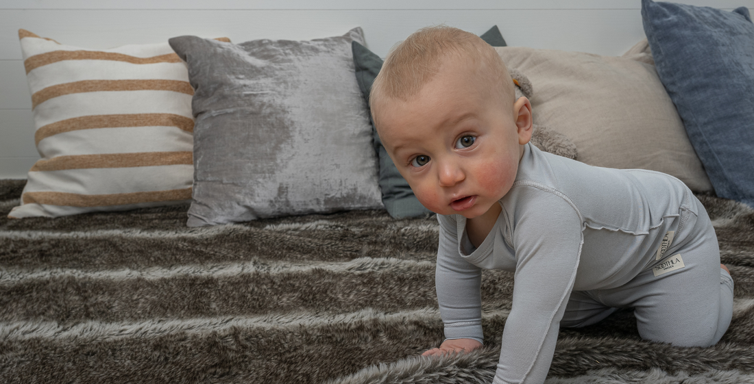 baby crawling wearing soothla