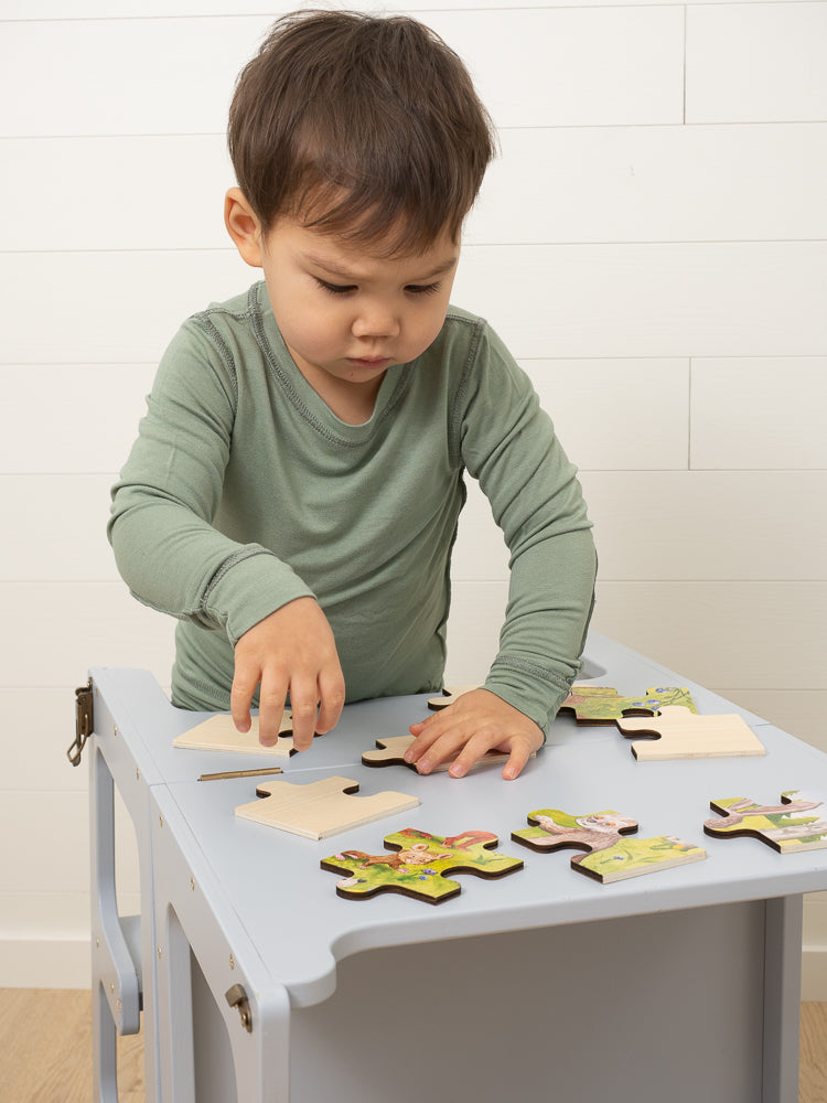 Boy Playing With Jigsaw Puzzle Wearing SOOTHLA Allergy-friendly Clothing