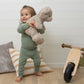 Girl Wearing Allergy-friendly Baby Bodysuit And Legging From SOOTHLA 