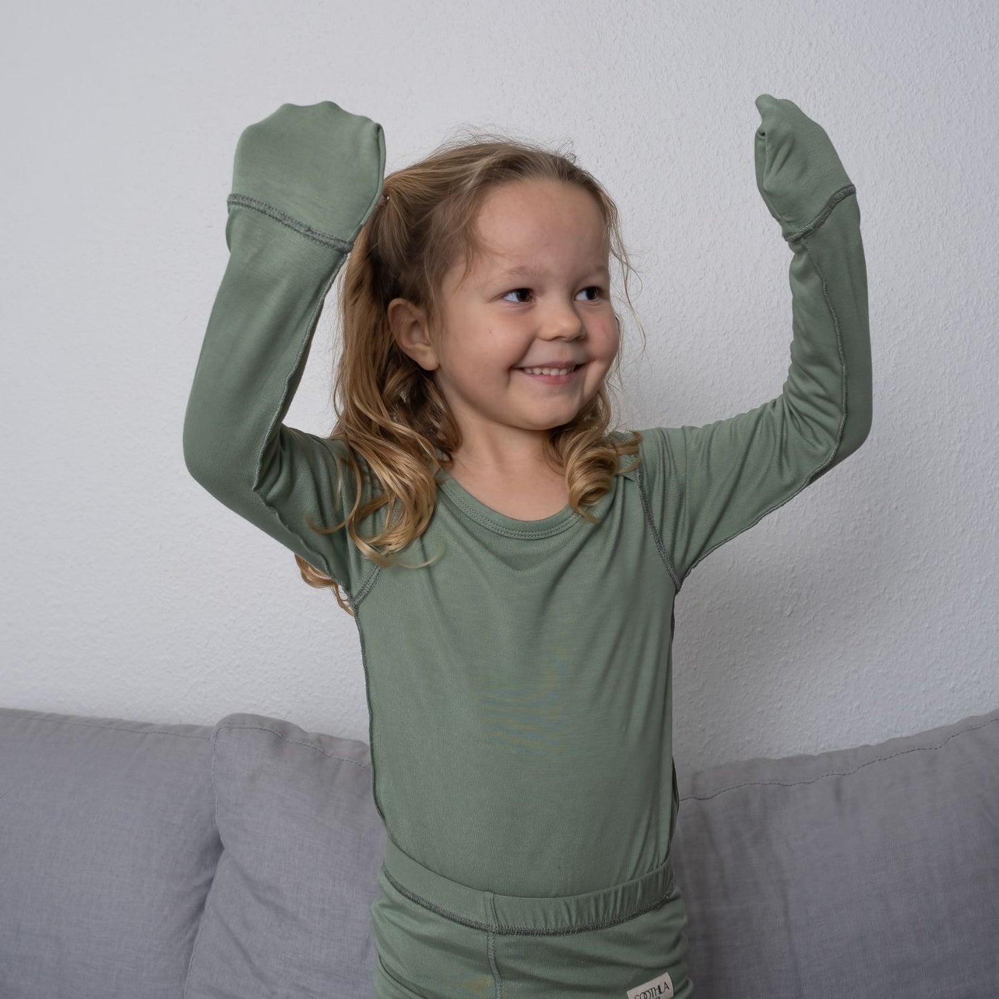 Little Girl Showing Her Anti-scratch Mittens From SOOTHLA