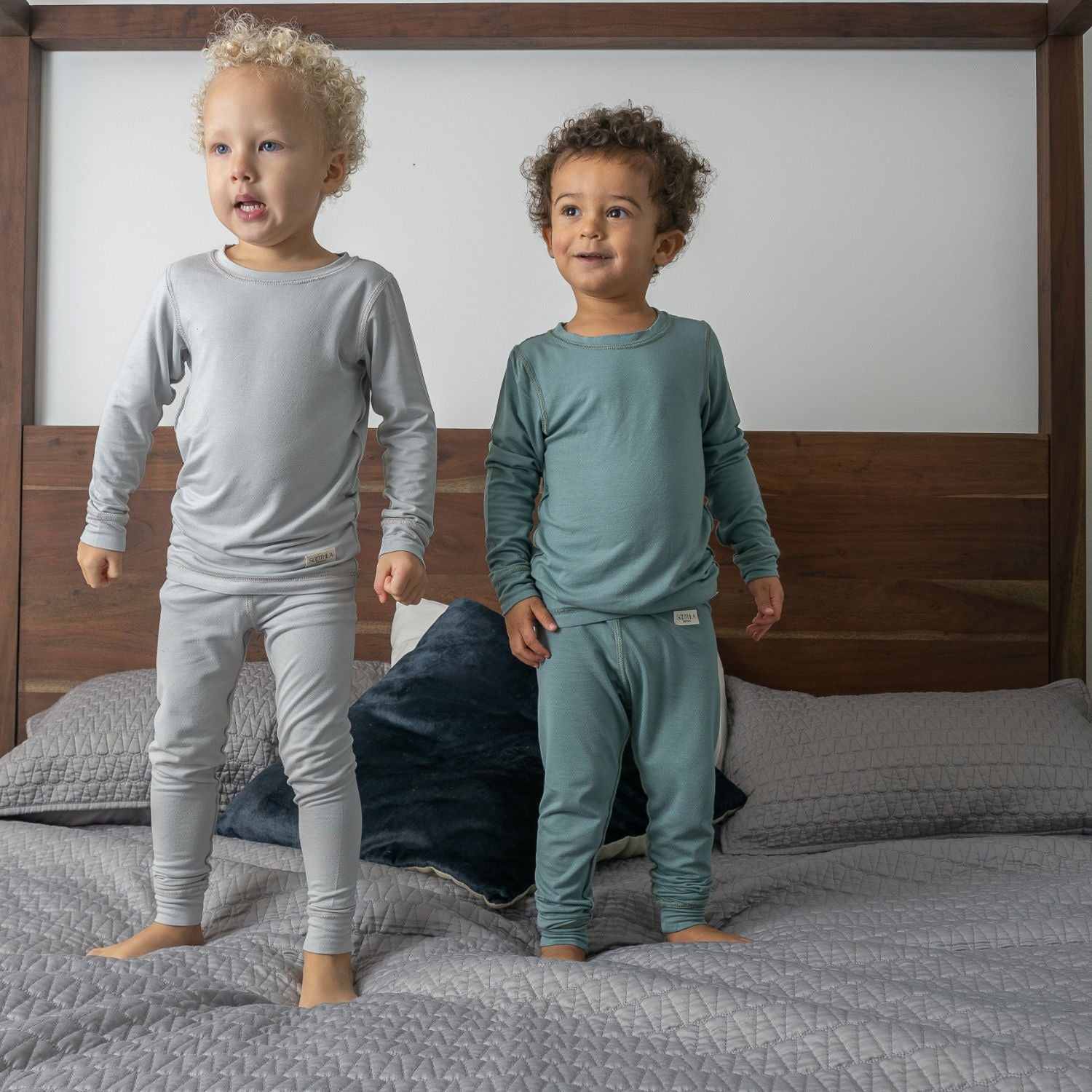 Boys Wearing Allergy-friendly Clothing From SOOTHLA Standing On Bed