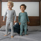 Boys Standing On Bed In SOOTHLA Allergy-friendly clothing.