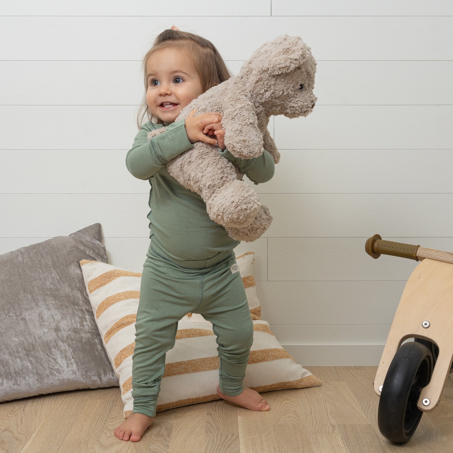 Toddler Wearing Green Bay Baby Bodysuit And Legging From SOOTHLA.