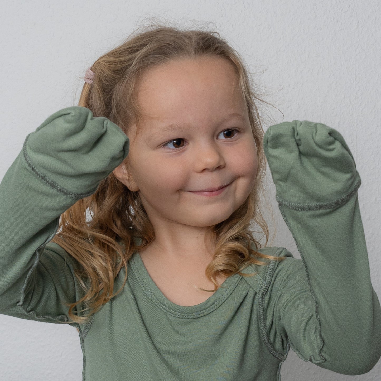 Toddler Showing Her Anti-scratch Mittens From SOOTHLA