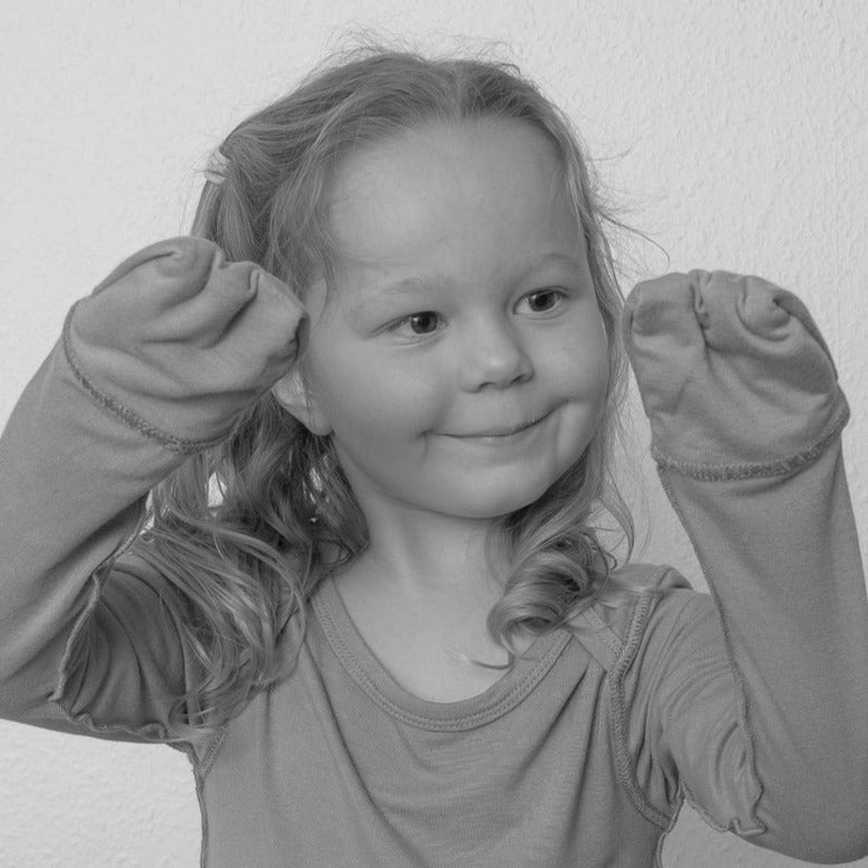 Toddler Showing Her Anti-scratch Mittens From SOOTHLA